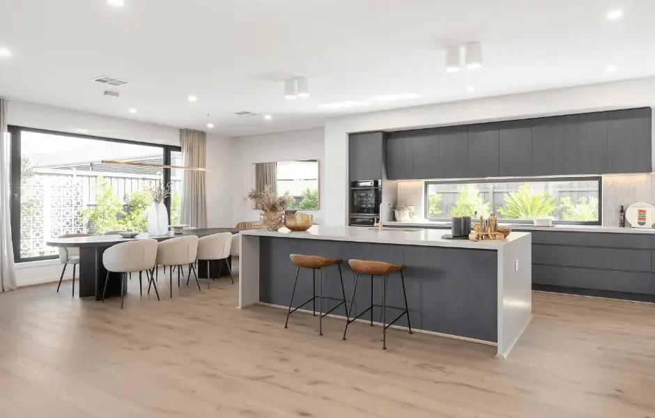A large well finished kitchen with large perfect windows